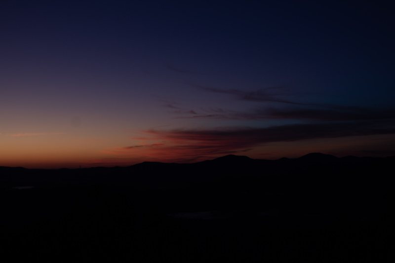 Orange afterglow along a dark horizon